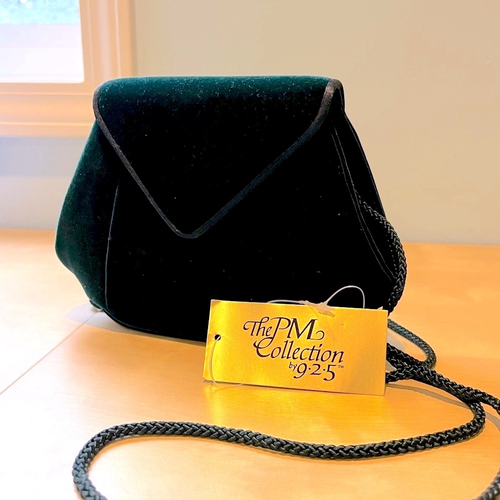 Sleek, green velvet evening bag